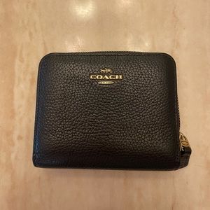 Black leather coach wallet with gold detail